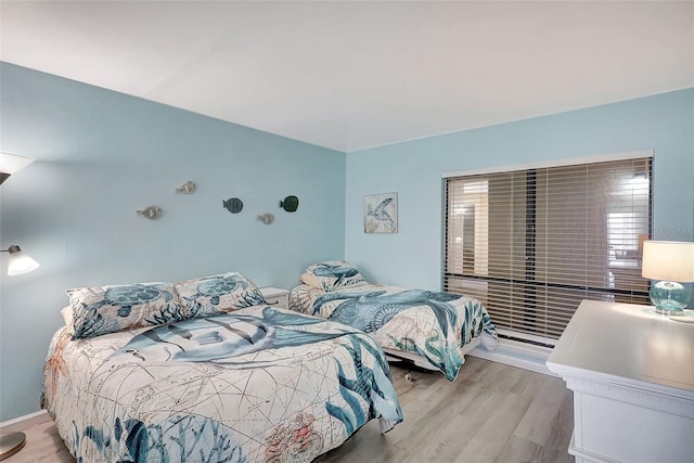 bedroom with light wood-type flooring