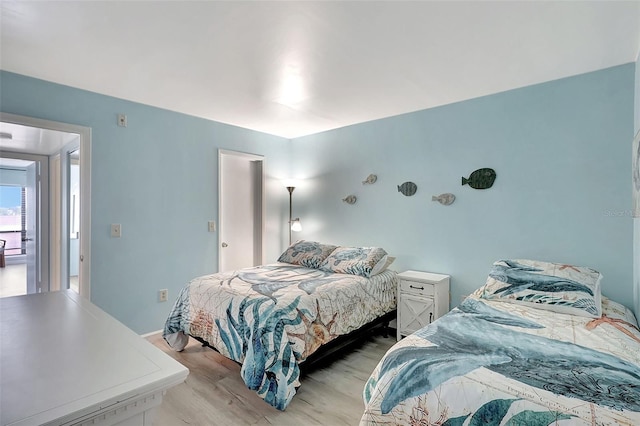 bedroom featuring light wood-style flooring