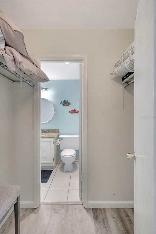 interior space featuring light wood-style flooring and a sink