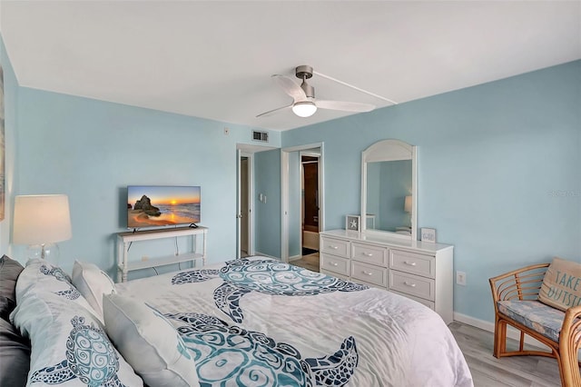 bedroom featuring baseboards, ceiling fan, light wood-style floors, and visible vents