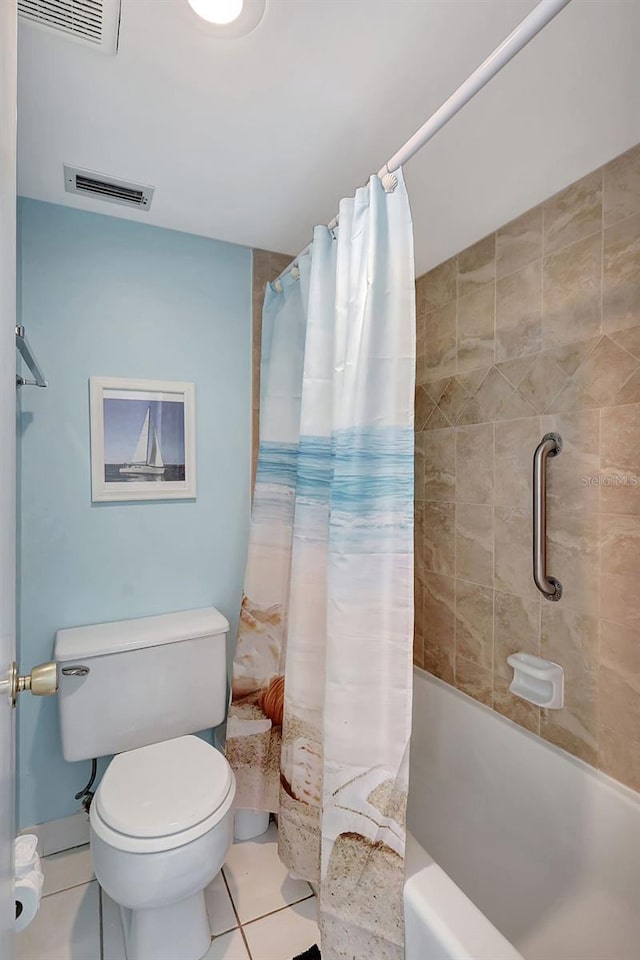 full bath featuring toilet, shower / bathtub combination with curtain, visible vents, and tile patterned floors