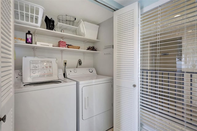 clothes washing area featuring laundry area and washing machine and dryer