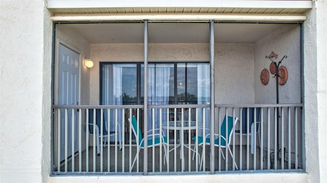 doorway to property with stucco siding