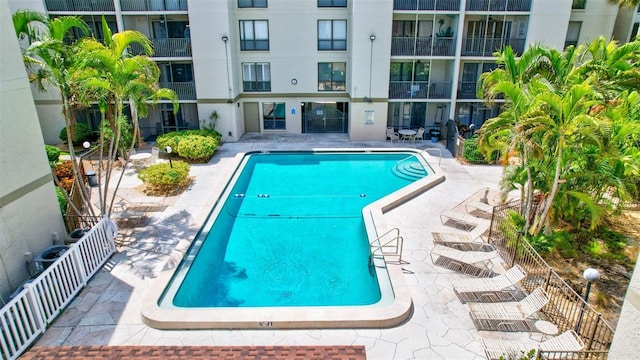 community pool with a patio area