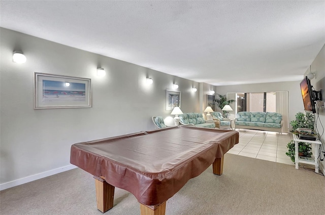 rec room with billiards, light carpet, baseboards, and a textured ceiling