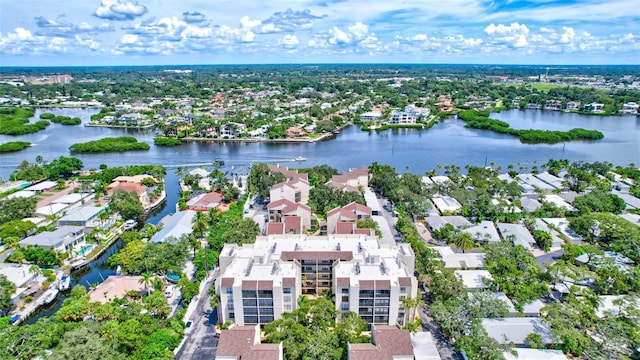 drone / aerial view featuring a water view and a residential view