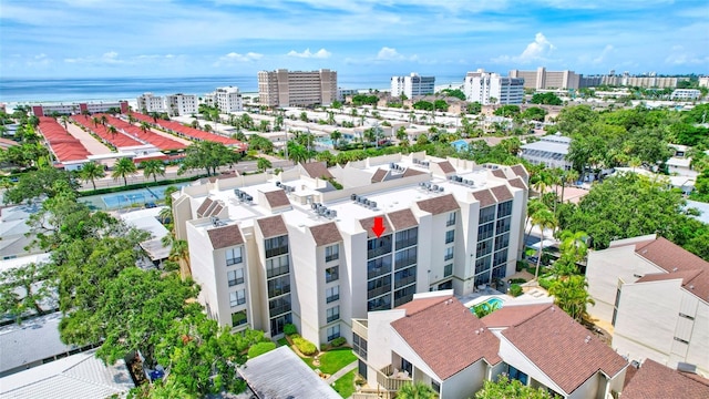 birds eye view of property featuring a city view and a water view
