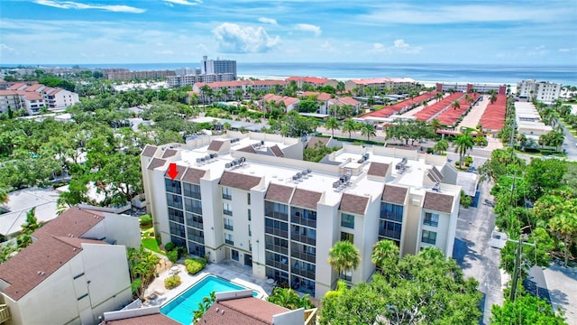 birds eye view of property featuring a city view and a water view