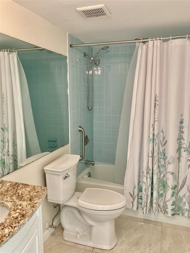 6430 Sun Eagle Ln Unit 203, Bradenton, FL 34210 - bathroom featuring toilet, tile patterned flooring, vanity, and shower / bathtub combination with curtain