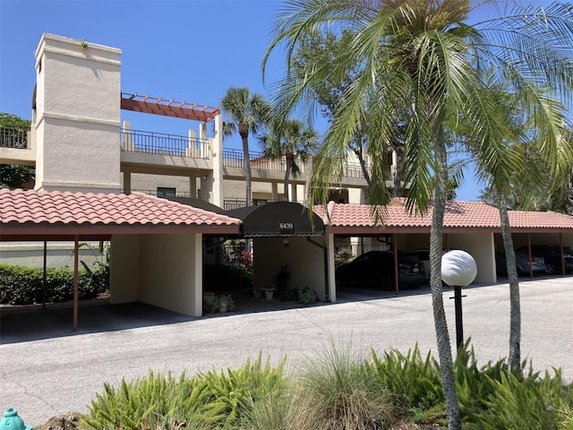 6430 Sun Eagle Ln Unit 203, Bradenton, FL 34210 - view of property with covered parking