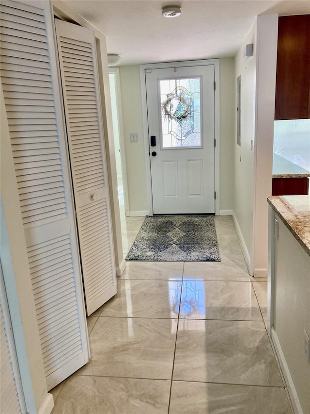6430 Sun Eagle Ln Unit 203, Bradenton, FL 34210 - foyer entrance featuring baseboards and light marble finish floors