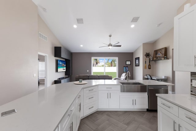 kitchen with a sink, stainless steel dishwasher, a ceiling fan, light countertops, and recessed lighting