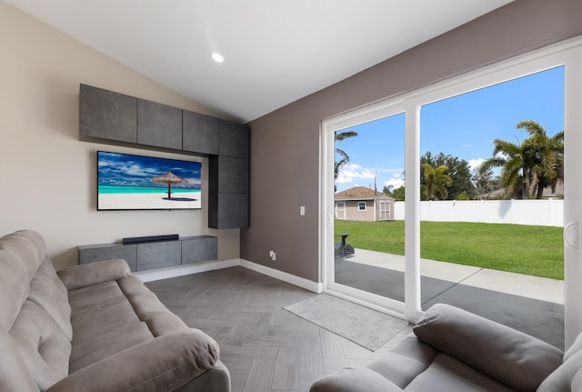 living room featuring baseboards, lofted ceiling, and recessed lighting