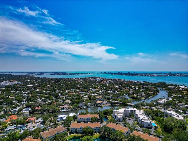 aerial view of a large body of water and apartment complex