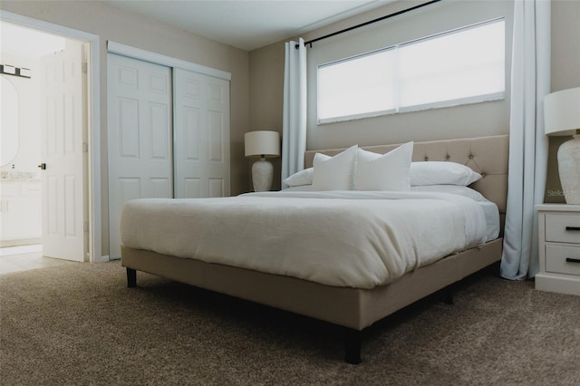 carpeted bedroom featuring a closet