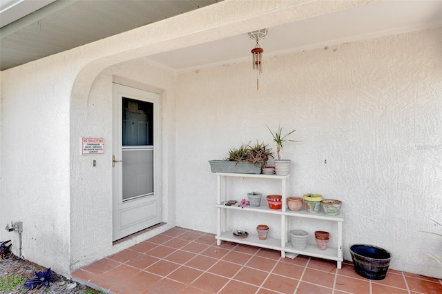 property entrance with stucco siding