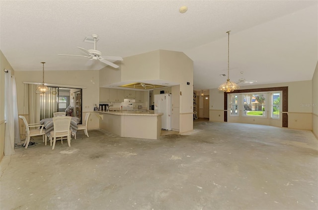 living area with vaulted ceiling, a ceiling fan, and concrete flooring
