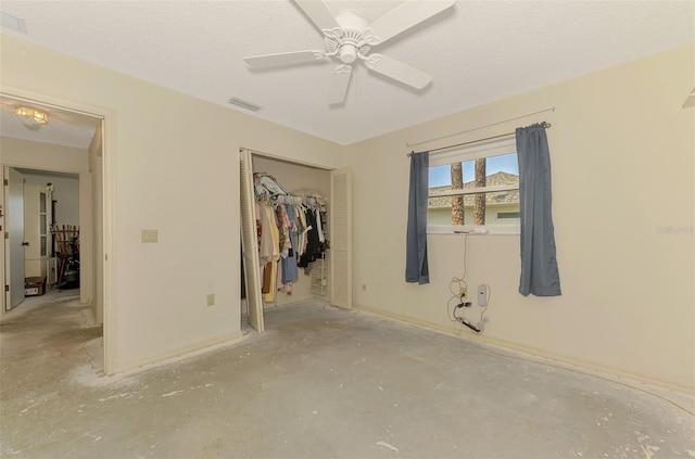 unfurnished bedroom with a closet and a ceiling fan