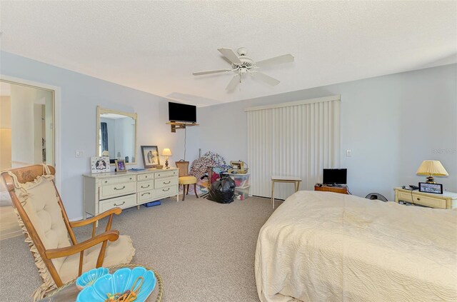 bedroom with carpet and a ceiling fan