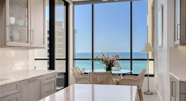 1241 Gulf Of Mexico Dr Unit 803, Longboat Key, FL 34228 - dining area featuring a water view and baseboards