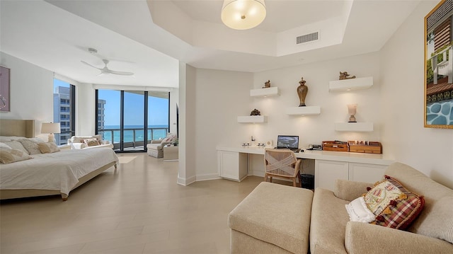 1241 Gulf Of Mexico Dr Unit 803, Longboat Key, FL 34228 - bedroom with access to exterior, a wall of windows, a tray ceiling, baseboards, and ceiling fan