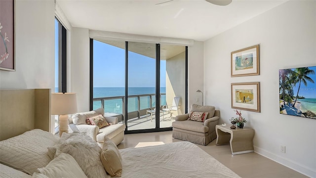 1241 Gulf Of Mexico Dr Unit 803, Longboat Key, FL 34228 - bedroom featuring floor to ceiling windows, access to exterior, wood finished floors, and baseboards