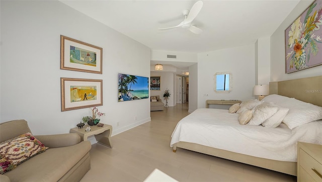 1241 Gulf Of Mexico Dr Unit 803, Longboat Key, FL 34228 - bedroom with light wood-style floors and ceiling fan