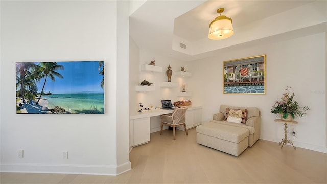 1241 Gulf Of Mexico Dr Unit 803, Longboat Key, FL 34228 - home office featuring built in desk, light wood-style floors, and baseboards