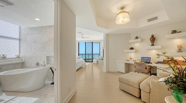 1241 Gulf Of Mexico Dr Unit 803, Longboat Key, FL 34228 - bathroom featuring ensuite bath, a soaking tub, and baseboards
