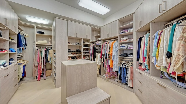 1241 Gulf Of Mexico Dr Unit 803, Longboat Key, FL 34228 - walk in closet with light wood-style floors
