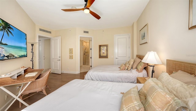 1241 Gulf Of Mexico Dr Unit 803, Longboat Key, FL 34228 - bedroom featuring wood finished floors, baseboards, ceiling fan, and ensuite bath