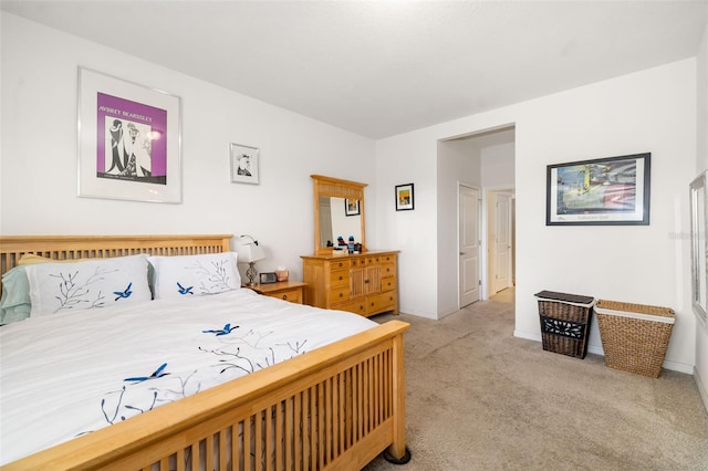 carpeted bedroom featuring baseboards