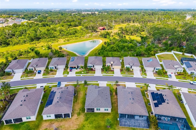 aerial perspective of suburban area featuring a nearby body of water