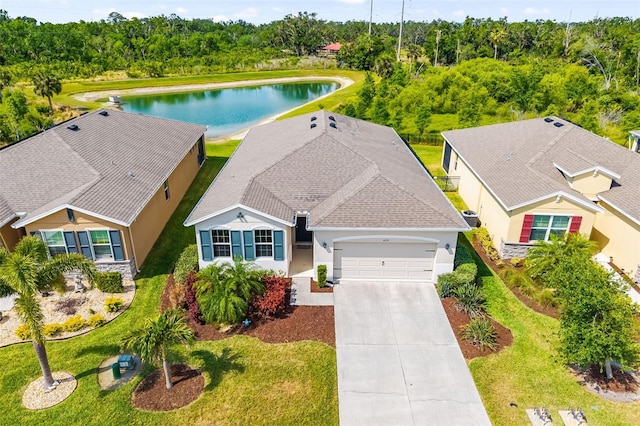aerial view of property and surrounding area with a large body of water