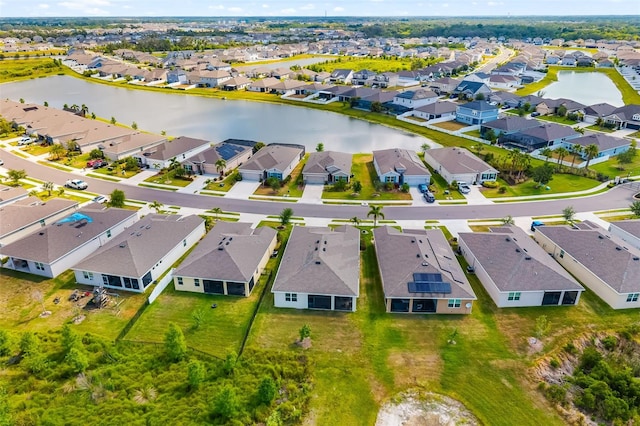 aerial perspective of suburban area with a nearby body of water