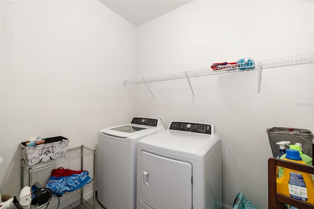 clothes washing area featuring washing machine and clothes dryer