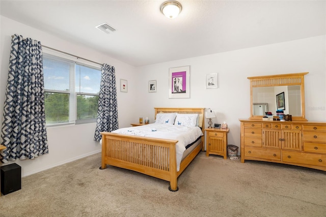 carpeted bedroom with baseboards