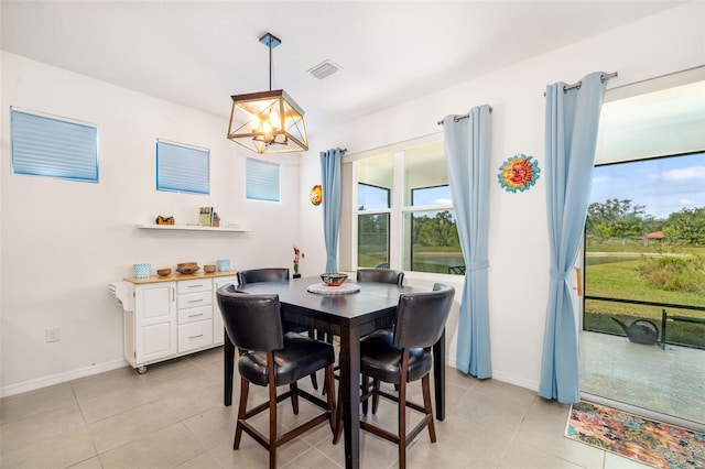 dining room featuring plenty of natural light, a chandelier, and light tile patterned floors