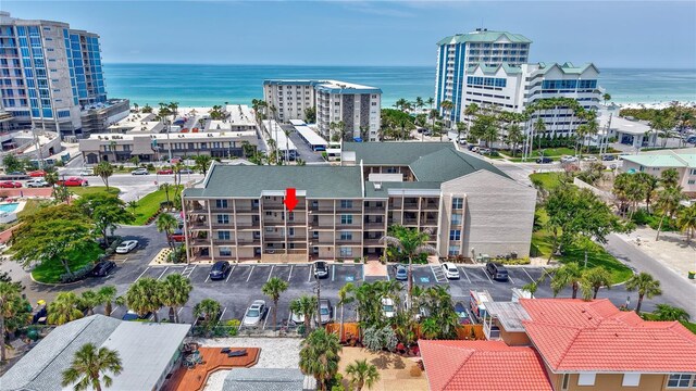 bird's eye view of a nearby body of water and apartment complex / building