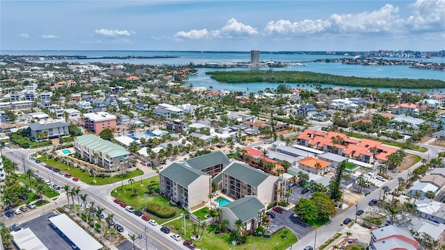 drone / aerial view of a nearby body of water and a notable bridge