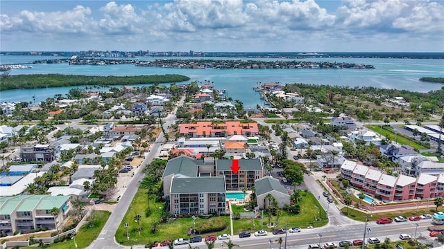 aerial perspective of suburban area with a large body of water