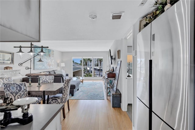 845 Benjamin Franklin Dr Unit 302, Sarasota, FL 34236 - dining space with light wood finished floors