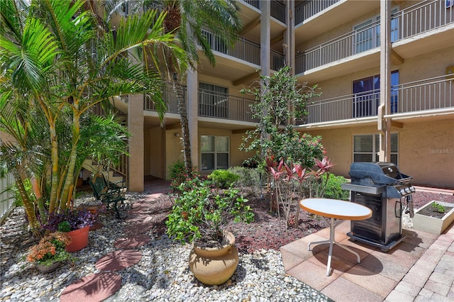 845 Benjamin Franklin Dr Unit 302, Sarasota, FL 34236 - view of patio featuring a grill