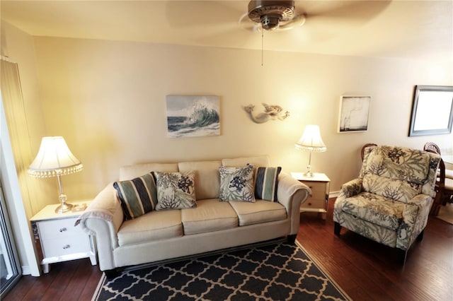 living room with wood-type flooring and a ceiling fan