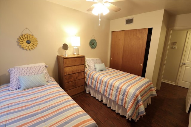bedroom featuring ceiling fan, hardwood / wood-style flooring, a closet, and visible vents