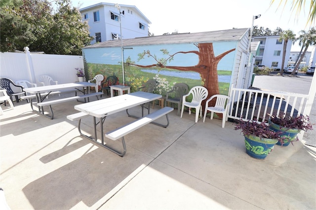 view of patio / terrace with outdoor dining area and fence