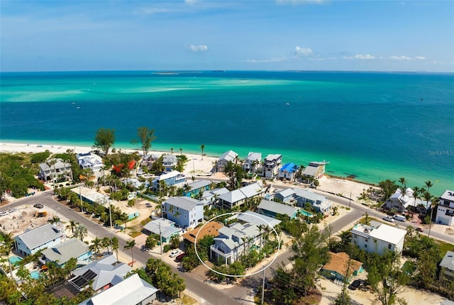 aerial view of waterfront with a beach