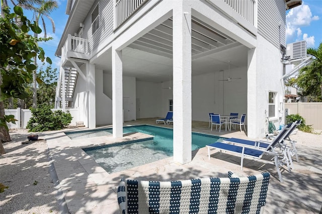 view of patio / terrace with fence, cooling unit, ceiling fan, and outdoor dining space