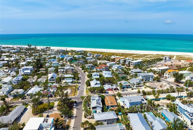 aerial view of residential area with waterfront with a beach