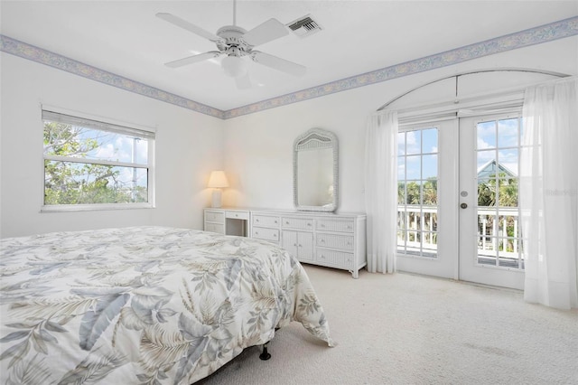 bedroom with access to exterior, french doors, light carpet, and a ceiling fan